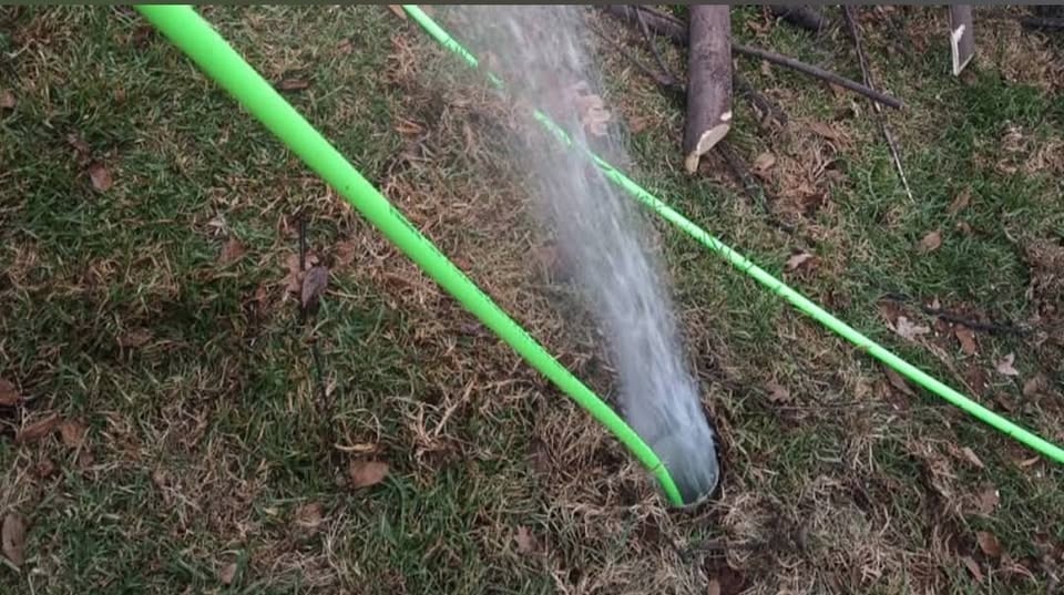 Burst pipe spraying water in garden Southern Suburbs