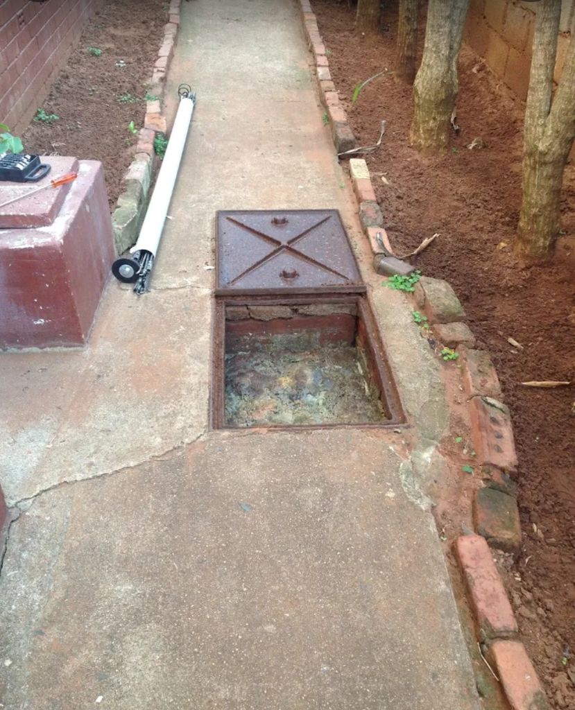 Blocked drain manhole inspection